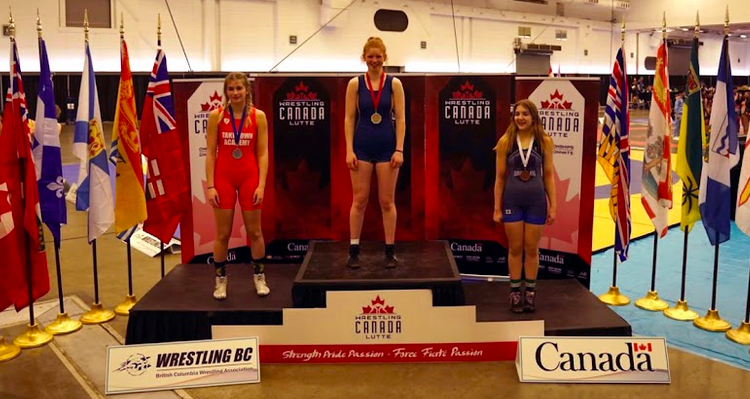 Standing on the podium, Sara McPhail's gold medal shines bright. Her victory in the Under 17, 69 Kilos girls divisions at the 2023 Canadian Wrestling Championships is the result of months of gruelling training and intense competition, including regionals, provincials, and the B.C. Summer Games. At only 14 years old, McPhail's achievement makes her one of the youngest Under 17 wrestling champions in the country - a testament to her immense talent and potential for even greater success in the future.