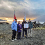 Gary Anandasangaree, Judi Thomas, Jeff Jones, and Dave Tovell, sign an agreement to return the use of ?A:?b?e:?s | Middle Beach to Pacheedaht First Nation near Port Renfrew, BC.