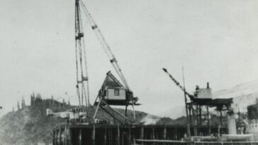 View of one of the Douglas World Cruiser aircraft being hoisted out of the water for repairs at Prince Rupert, BC, in April 1924.