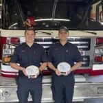 Ryan Fuzi Prince Rupert Fire Fighter of the Year (left), and Dylan Sidoni, Fire Officer of the Year, pose with their plaques at the Prince Rupert Fire Hall. Prince Rupert Fire Rescue