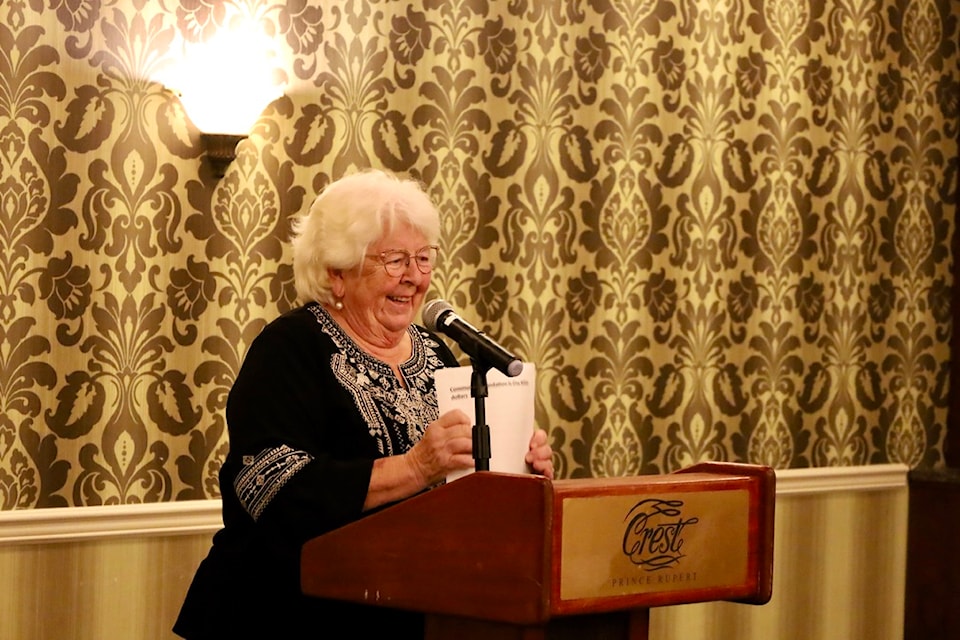 Linda Lutz stands at a podium at an event awarding grants to community organizations in Prince Rupert BC