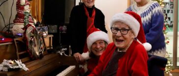 Charlotte Rowse played Christmas jingles on her piano while the crowd sang along during her annual women's sherry party on Dec. 6 at Acropolis Manor.