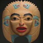 Dale Campbell's "Woman who Brought the Salmon" mask made of alder, abalone and pigment.